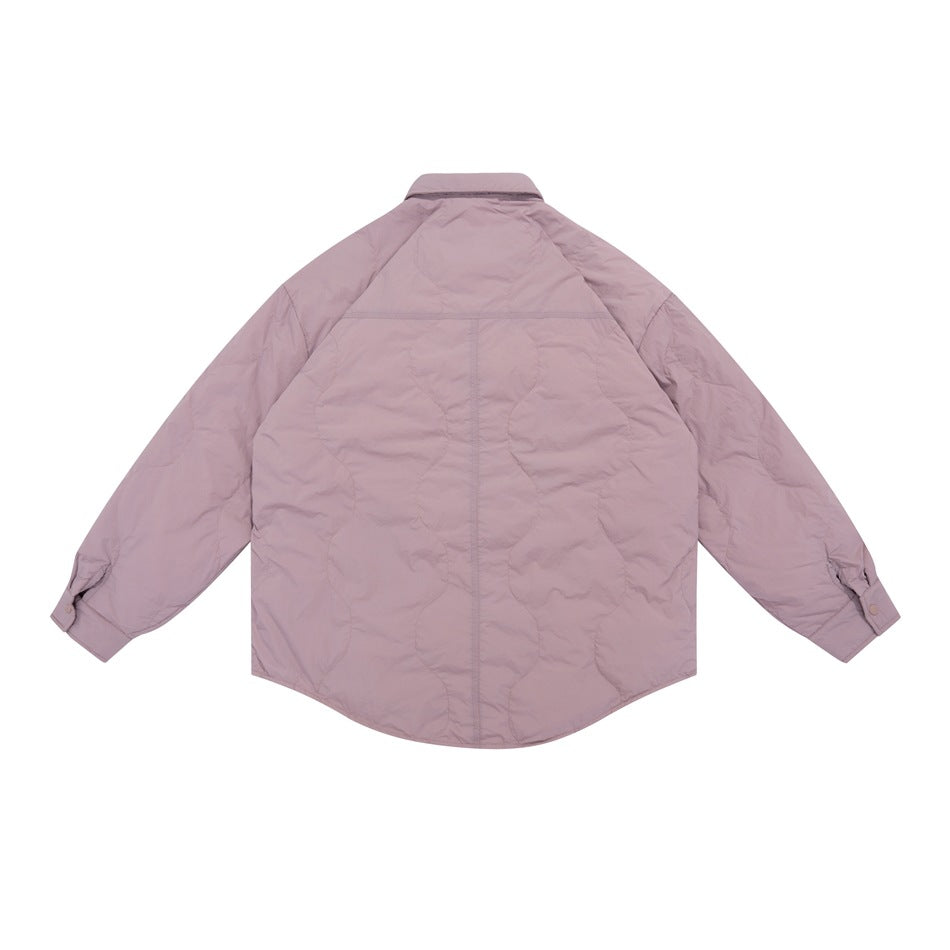 Back view of a dusty mauve quilted jacket with a pointed collar, long sleeves, snap cuffs and a curved hem.