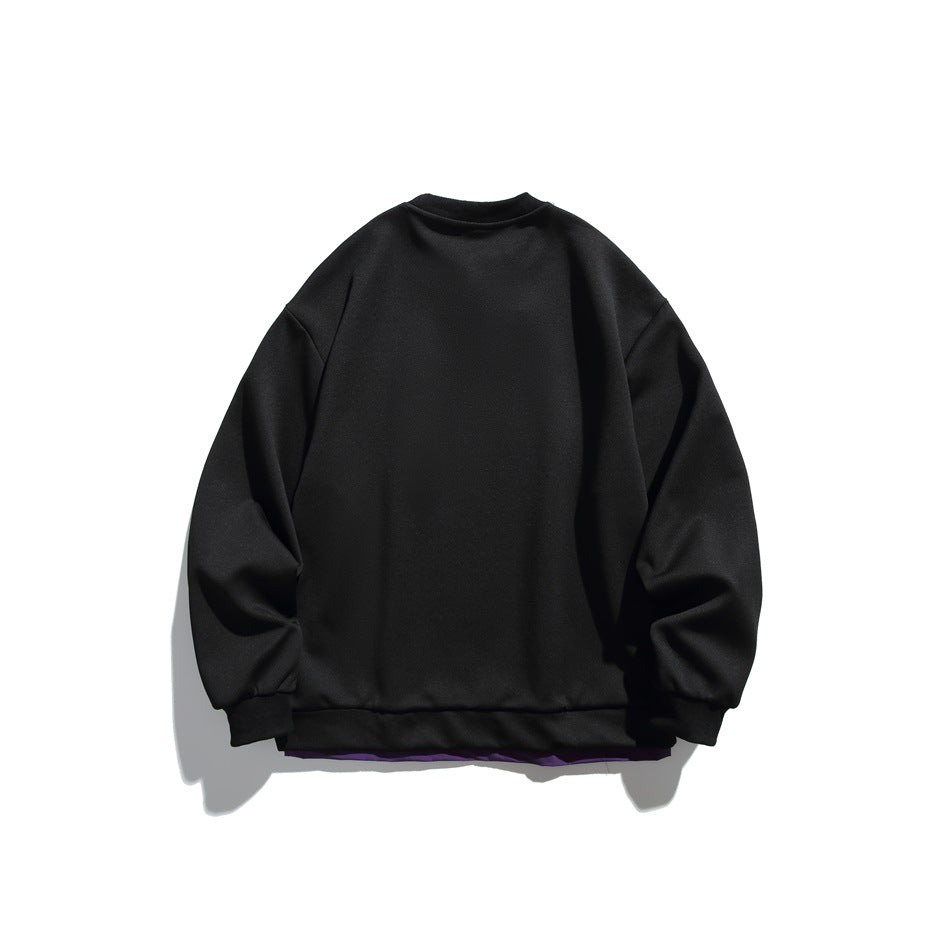 Back view of a black crew-neck sweatshirt with dropped shoulders and a purple layer under the hem