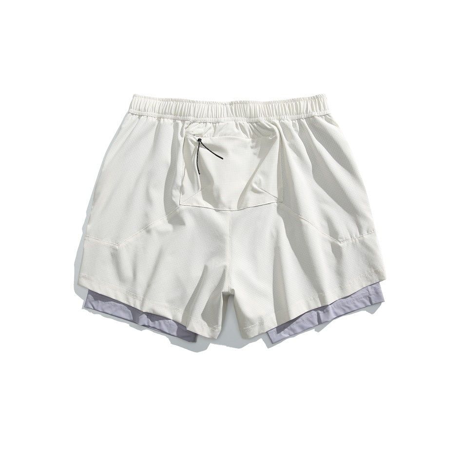 White layered athletic shorts, back view, with an elastic waistband, center rear pocket and pale lavender inner shorts.
