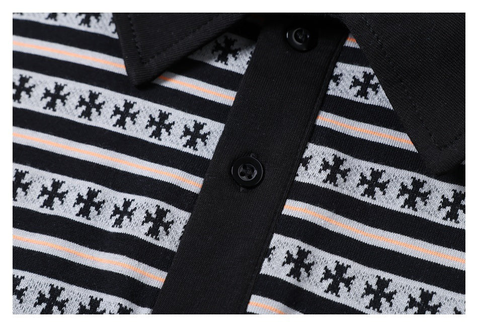 Close-up of a black polo collar and button placket on a gray, black, and thin peach striped shirt.