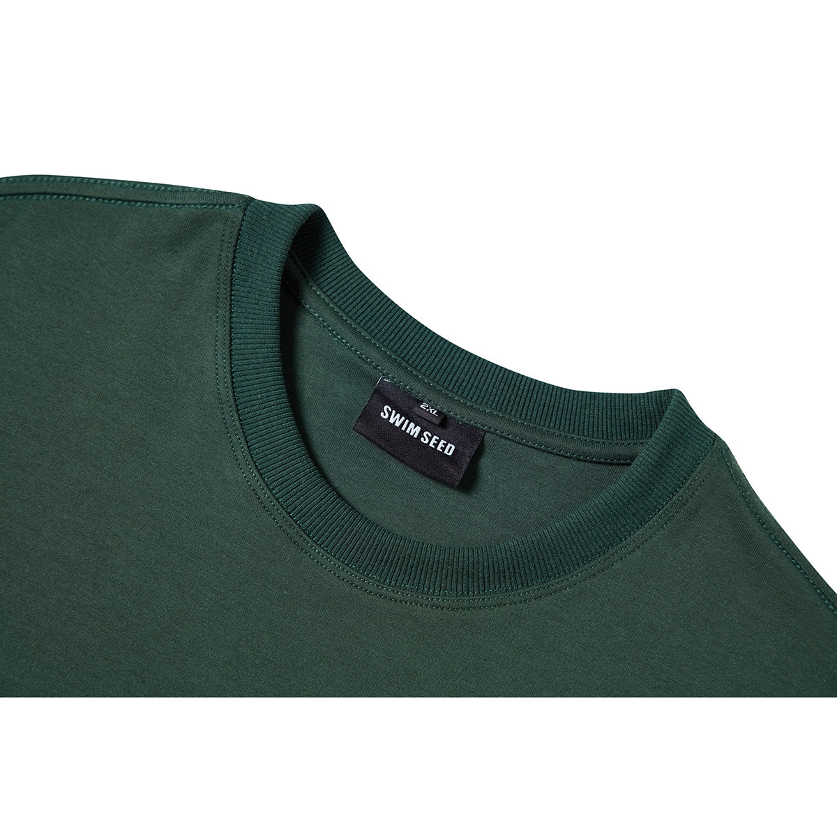 Close-up of a dark green T-shirt's ribbed crew neck and sewn-in SWIM SEED label.