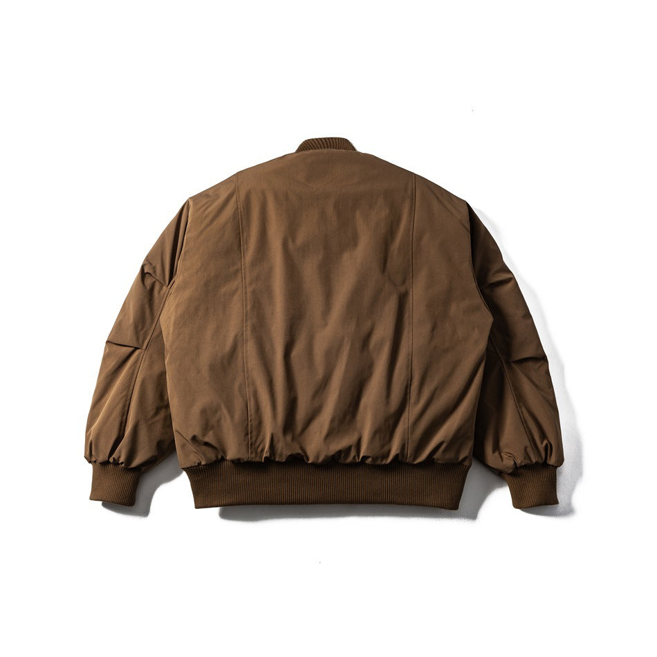 Back view of a brown jacket with a ribbed collar, cuffs and hem, laid flat on white.