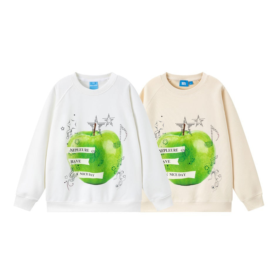 White and cream crewneck sweatshirts shown from the front, each with a green apple and music-themed graphic.