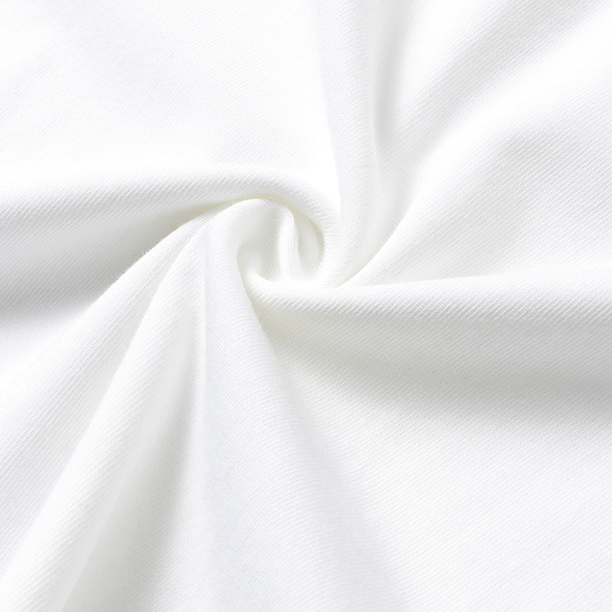 Close-up of white knit fabric gathered into a twist, showing its surface texture.