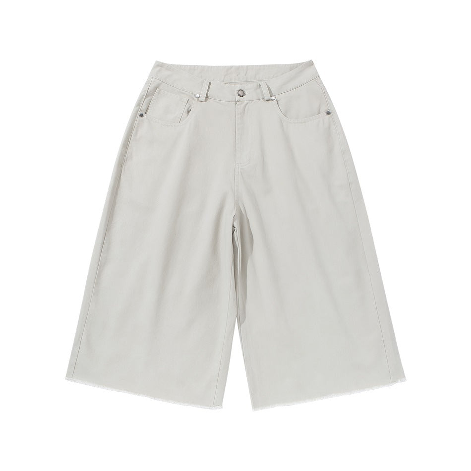 Light gray-white wide-leg knee-length shorts, front view, with button fly, belt loops, pockets and frayed hem