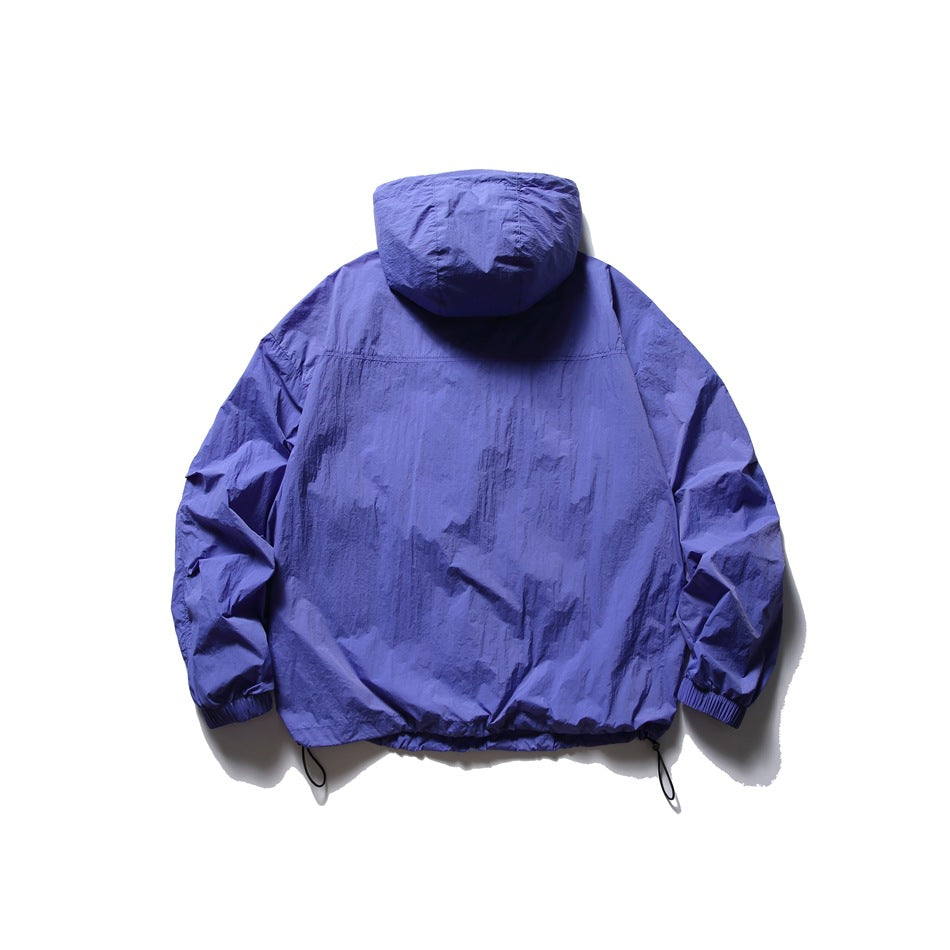 Back view of a vivid blue hooded jacket with elastic cuffs and adjustable drawcord hem.
