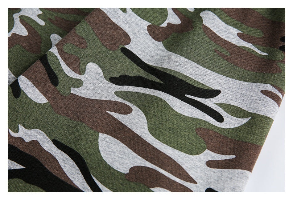 Close-up of the green, brown, gray, and black camouflage pattern on the garment.