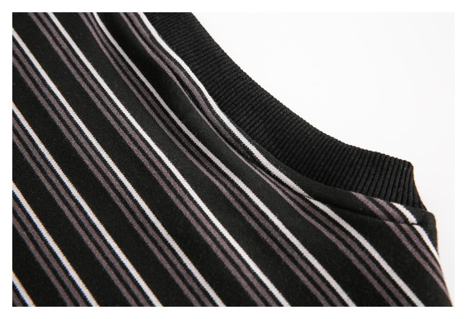 Close-up of the black ribbed neckline and narrow white and muted mauve stripes.