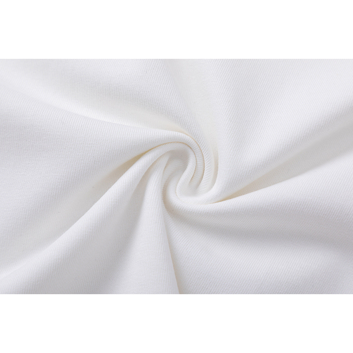 Close-up of white knit fabric gathered into a spiral, showing its surface texture.