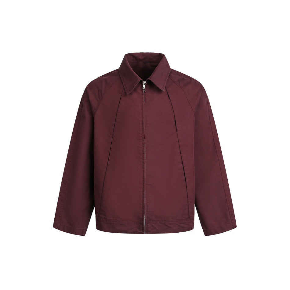 Wine-red zip-up short jacket with pointed collar and raglan sleeves, front view on white background