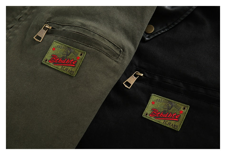 Close-up of olive and black jacket chest pockets, zippers and sewn-on patches.