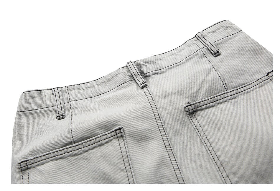 Cropped rear view of light gray washed denim shorts showing the waistband, belt loops and back pockets.