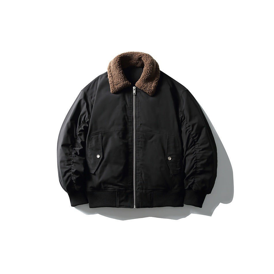Black zip-front bomber jacket with brown fleece-like collar, flap snap pockets and ribbed hem, flat view