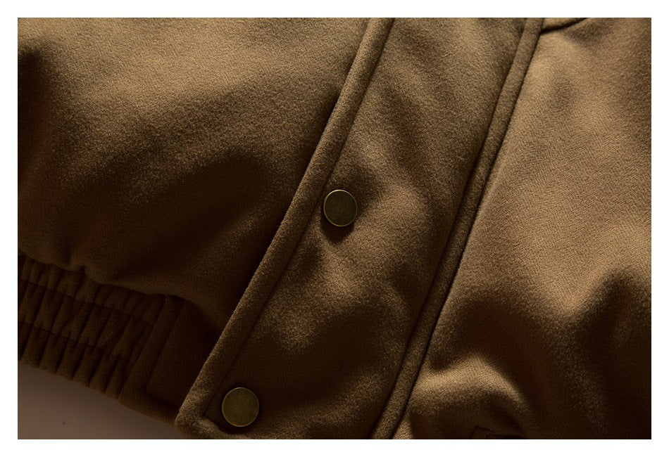 Close-up of a camel-brown coat’s snap-button front placket beside a gathered cuff.