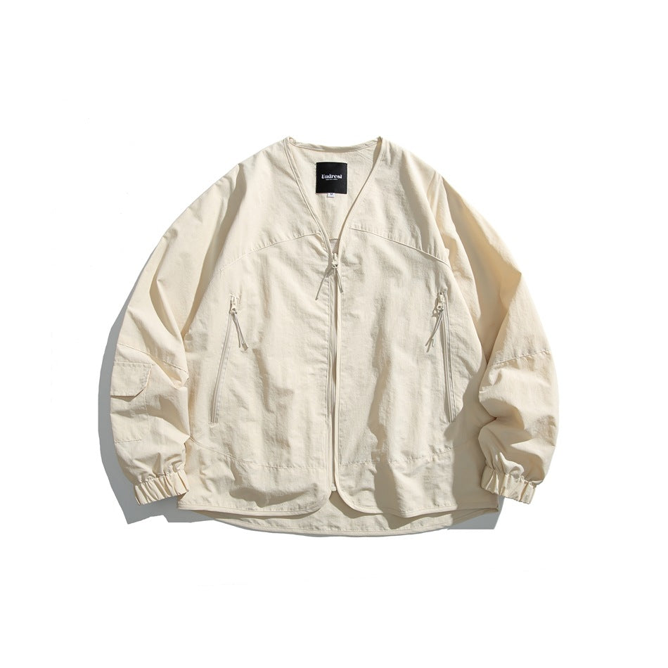 Beige V-neck zip-front nylon-look jacket with zippered side pockets and elasticized cuffs, flat lay front view