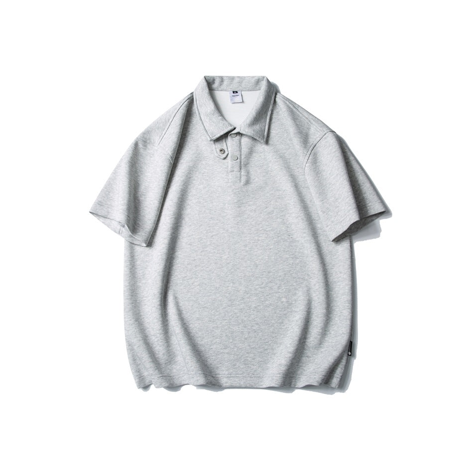 Heather gray short-sleeve polo shirt flat lay, front view, with folded collar, snap placket and relaxed shape