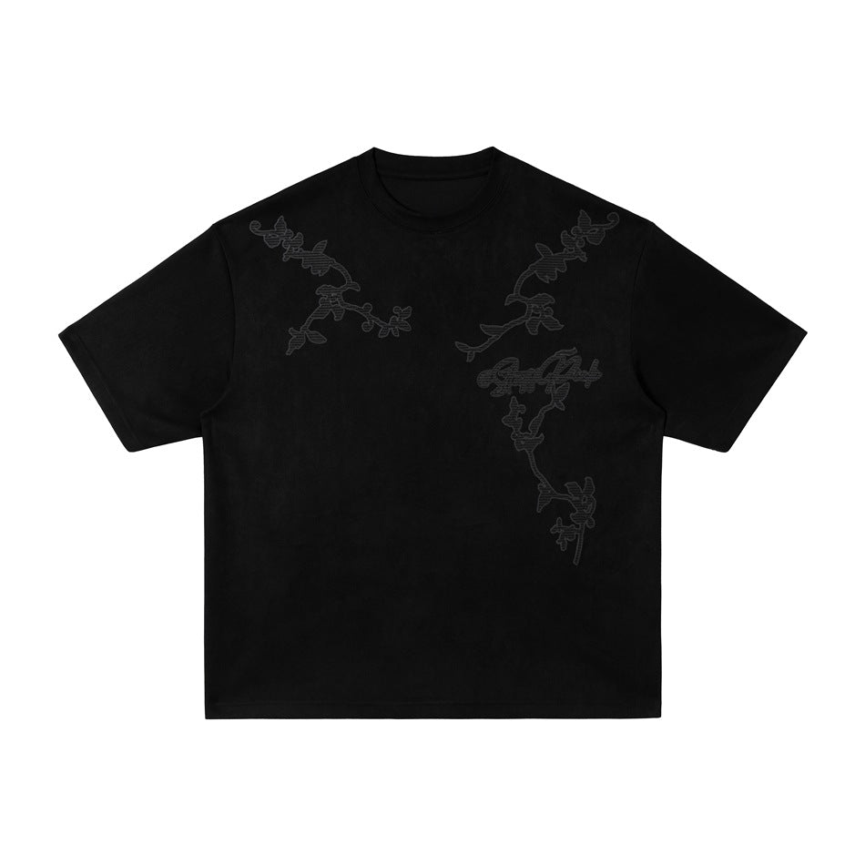 Black short-sleeve crew-neck T-shirt with tonal floral vine embroidery on the shoulders and chest, flat front view