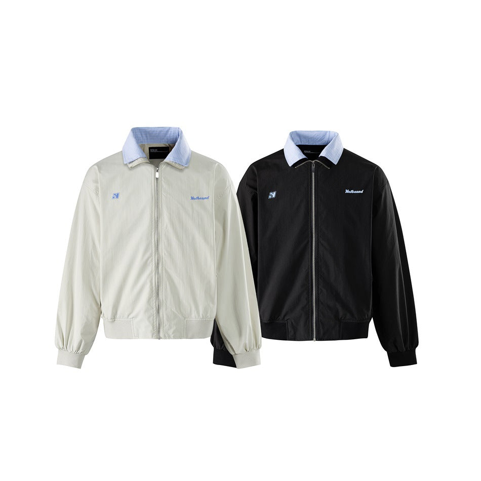 Ivory and black zip-front jackets shown side by side, both with blue checked collars and chest details.