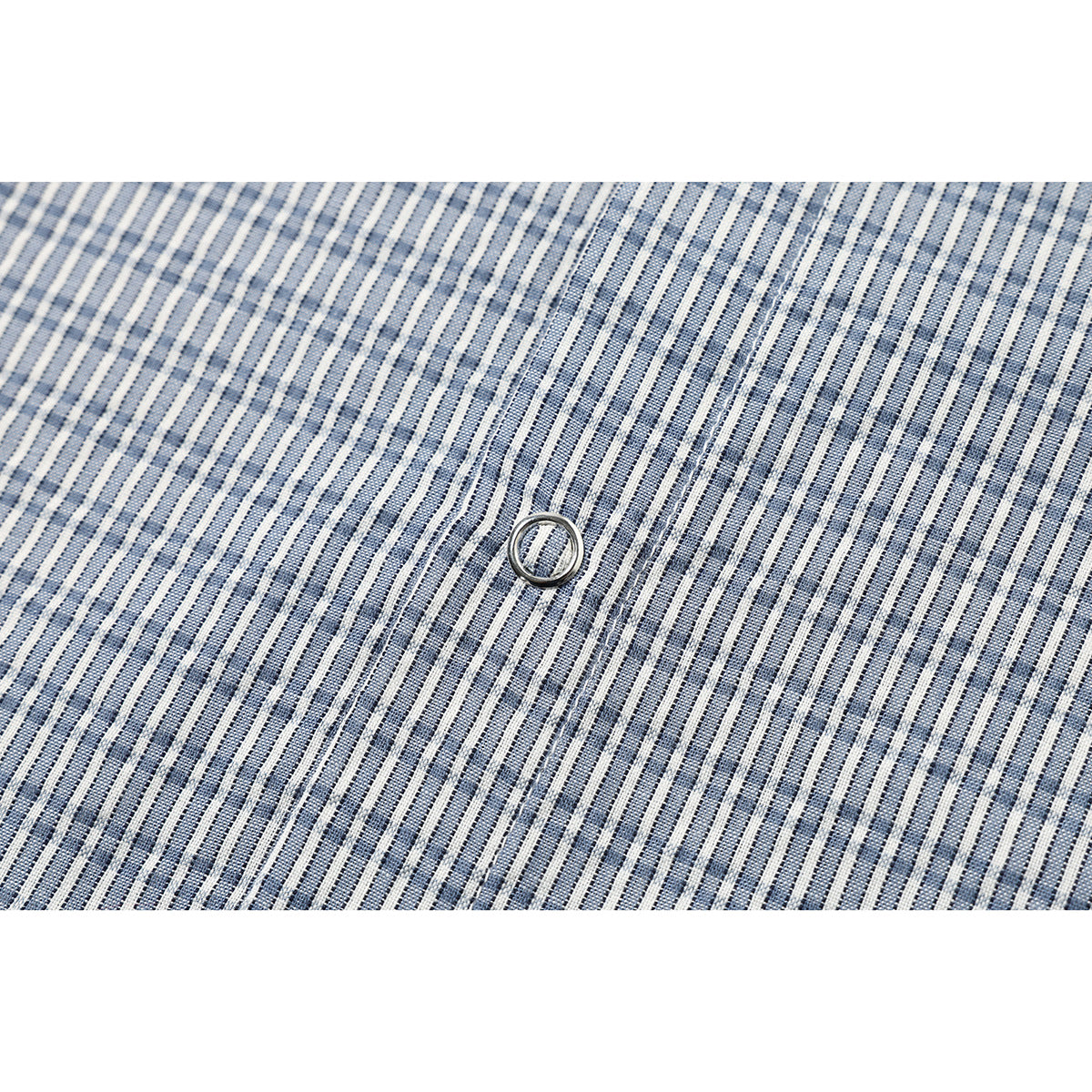Close-up of blue-and-white checked shirt fabric with a round button and stitched placket.