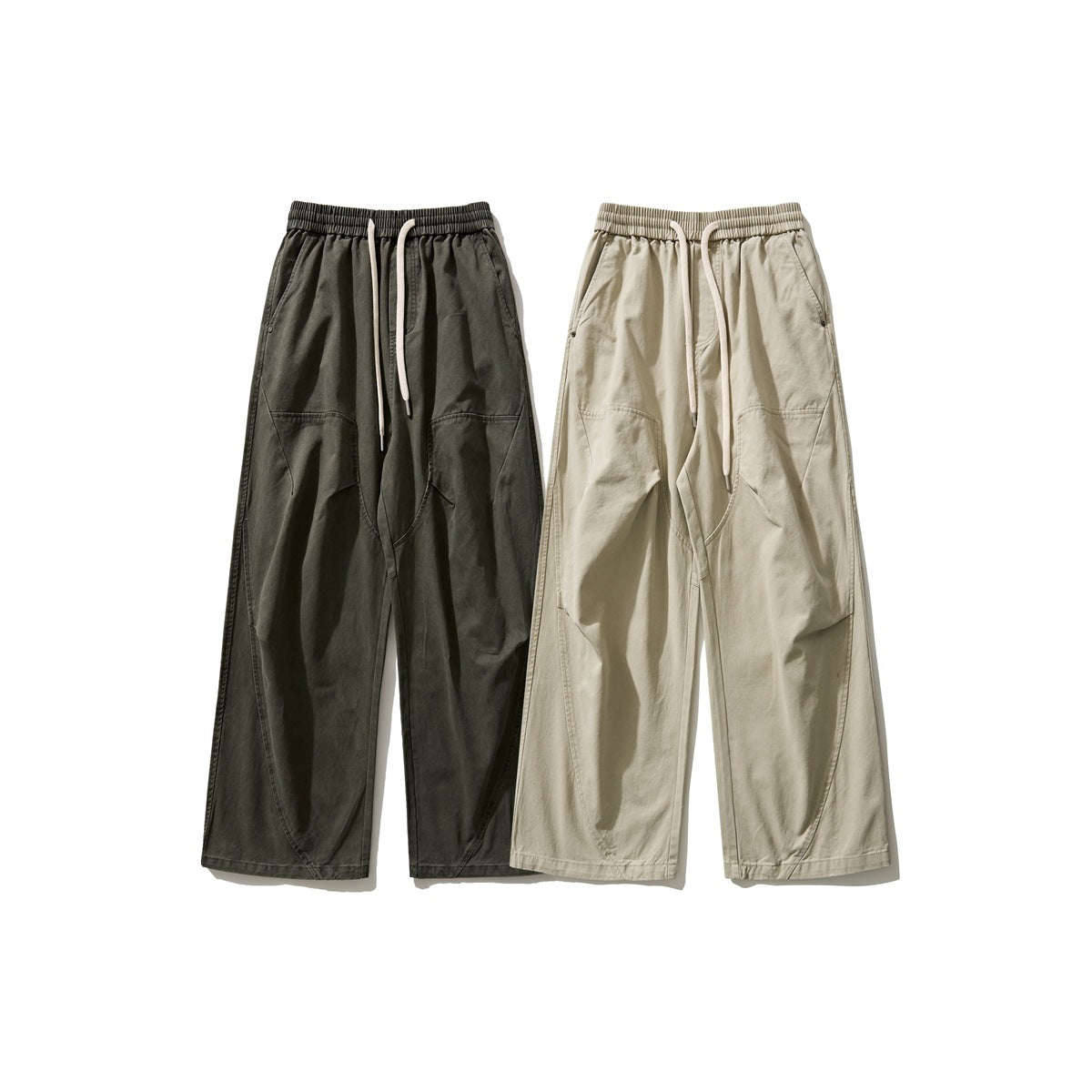 Front view of wide-leg drawstring trousers in dark charcoal and light beige, shown side by side.
