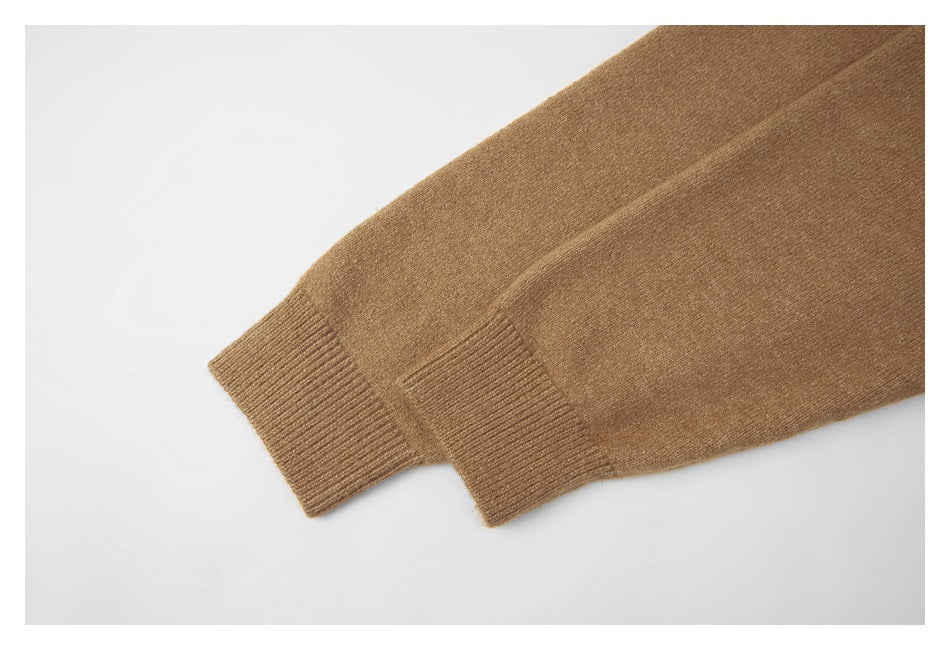 Close-up of the tan sweater's sleeve and ribbed cuff.