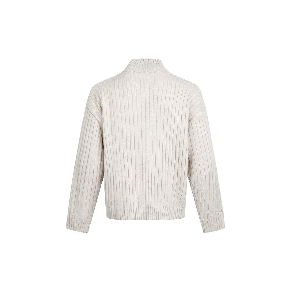 Back view of a beige wide-rib knit sweater with stand collar and ribbed hem and cuffs