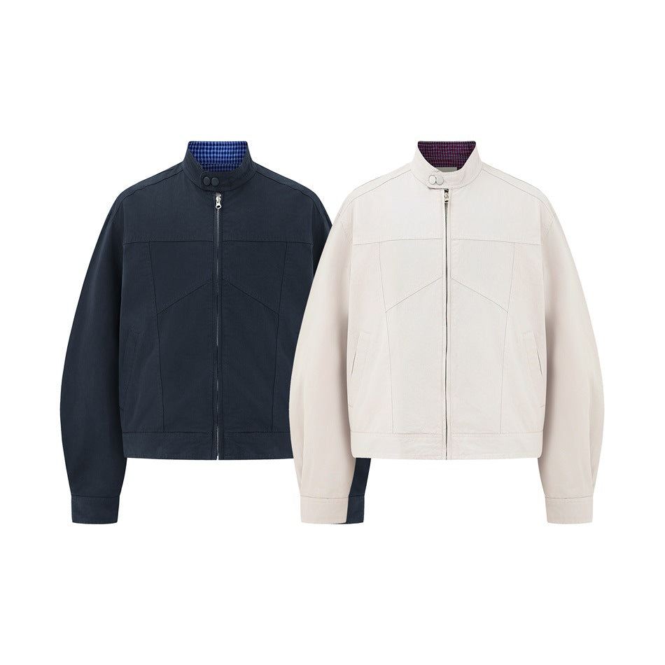 Front views of the same zip-front jacket in navy and ivory, each with a stand collar and plaid lining.