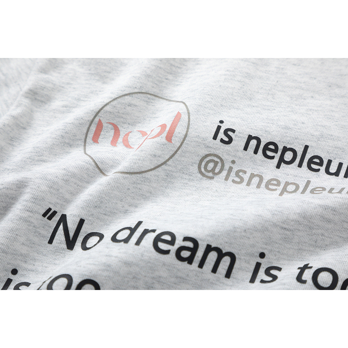 Close-up of the light heather gray T-shirt's printed English text and graphic.