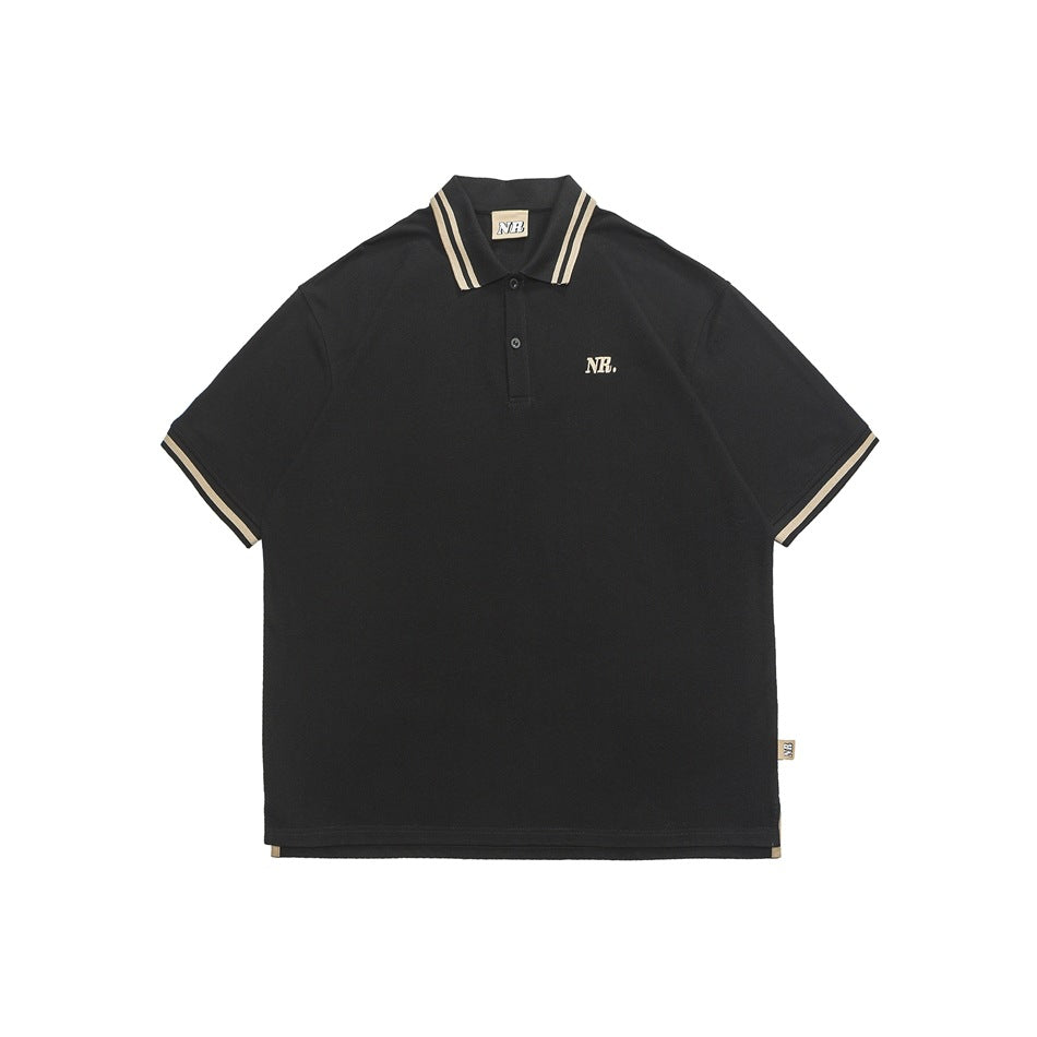 Black short-sleeve polo shirt with beige striped collar and cuffs and a small NR. chest mark, front view