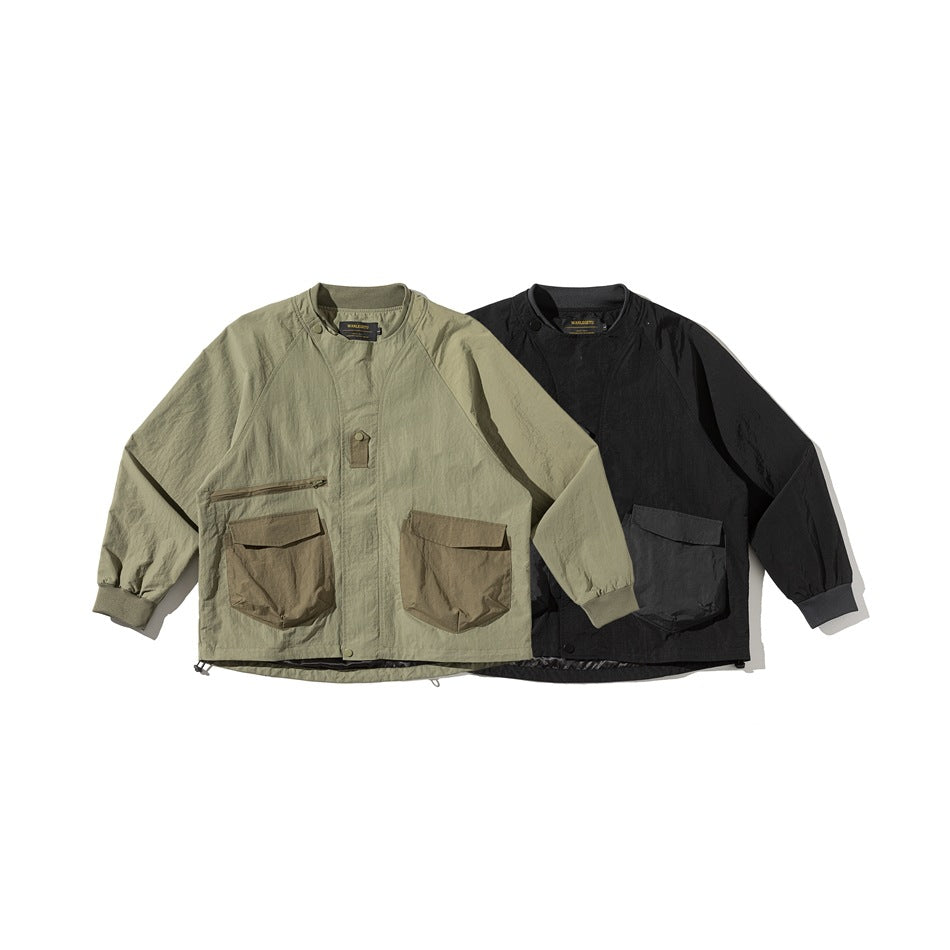 Front view of two utility jackets: olive with brown pockets and black with dark pockets.