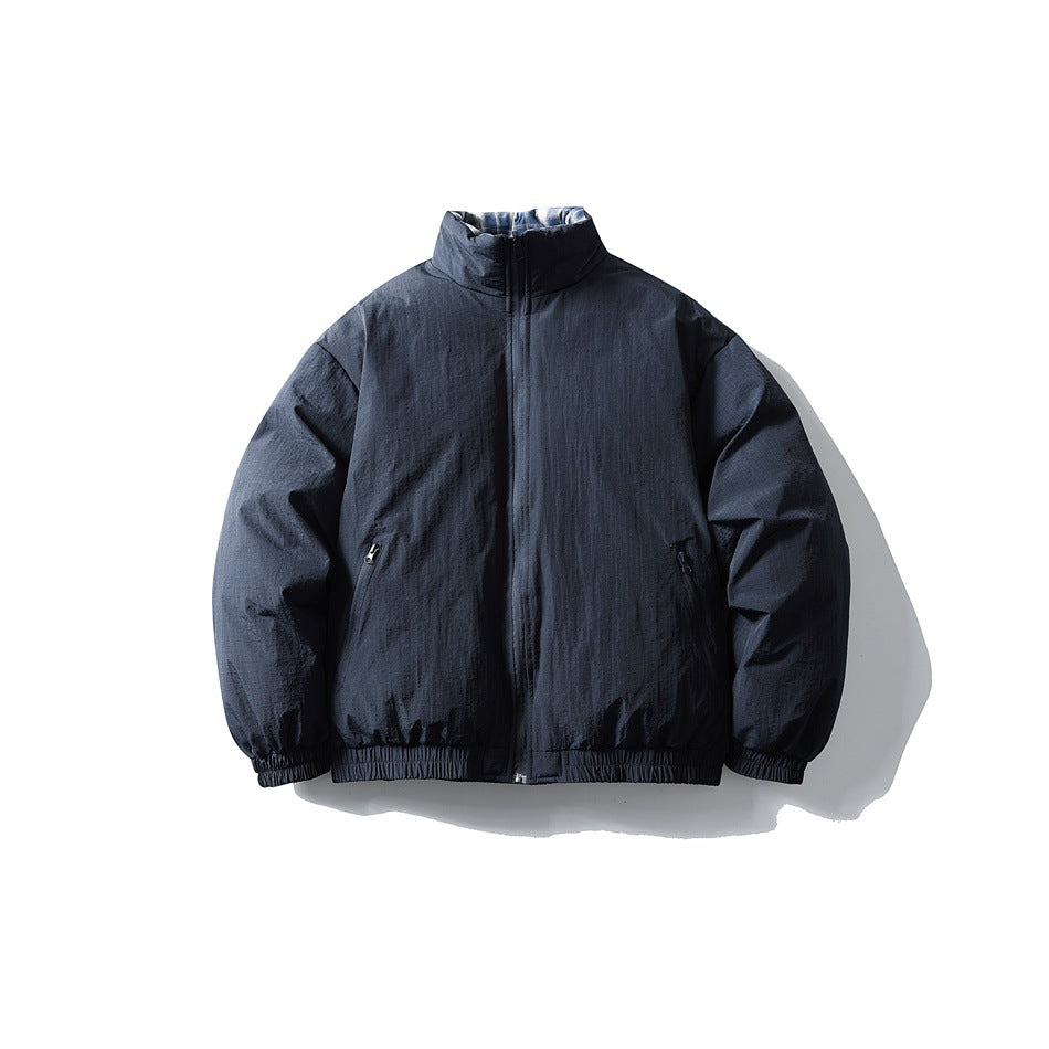 Navy blue padded stand-collar zip jacket, front flat lay with zippered pockets and elastic cuffs