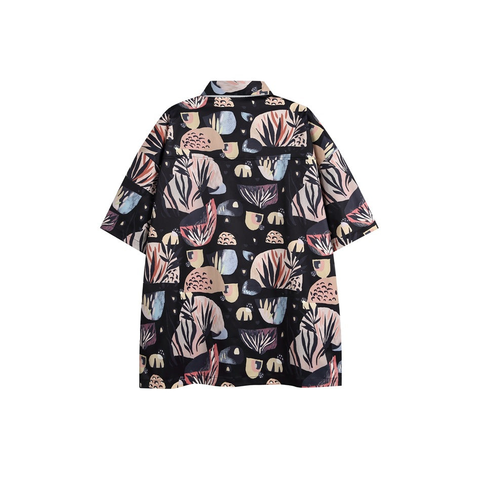 Back view of a short-sleeve collared shirt with an allover abstract botanical print on a dark background.