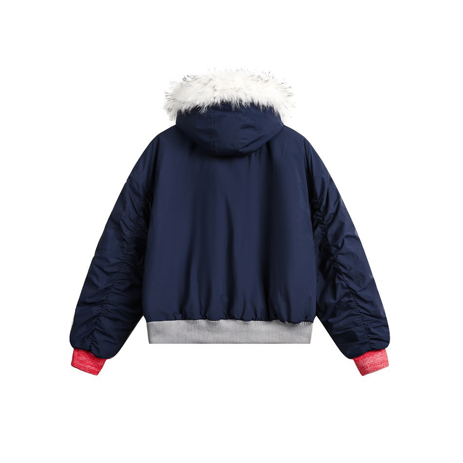 Back view of a navy hooded jacket with white faux-fur trim, red cuffs, and a gray ribbed hem.