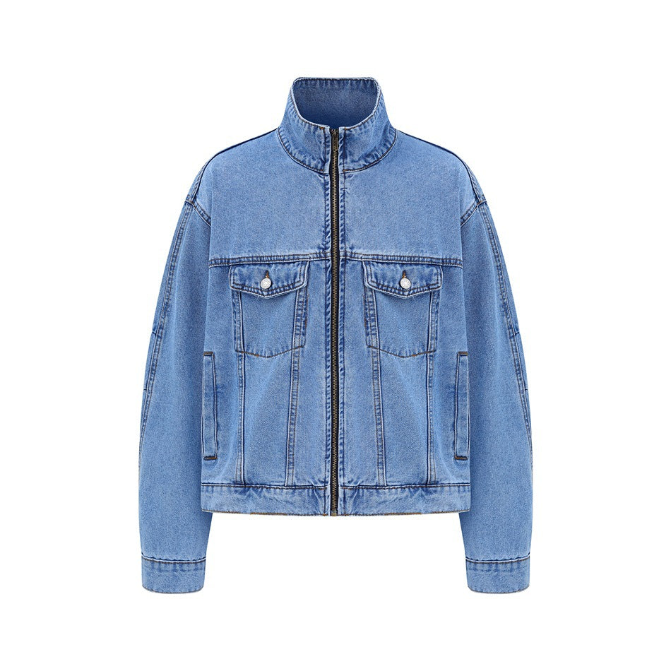 Light-blue washed denim jacket with stand collar, front zipper and two chest flap pockets, flat front view