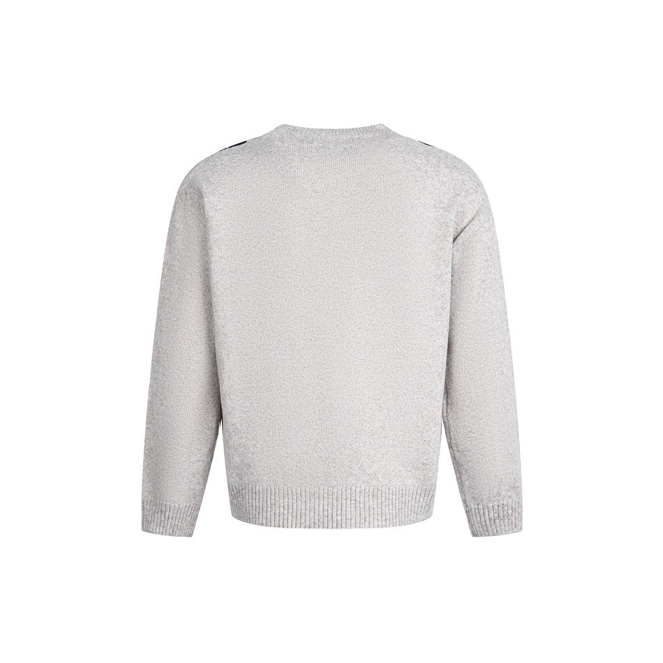 Back view of a light gray knit sweater with a plain back, ribbed hem and cuffs, and dark argyle at the shoulders