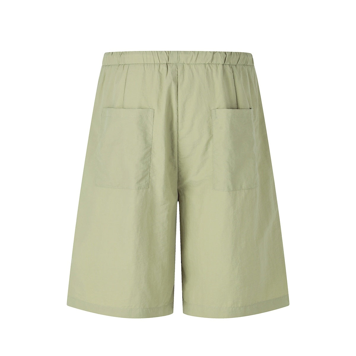 Back view of pale sage, wide-leg shorts with an elastic waistband and two patch pockets.