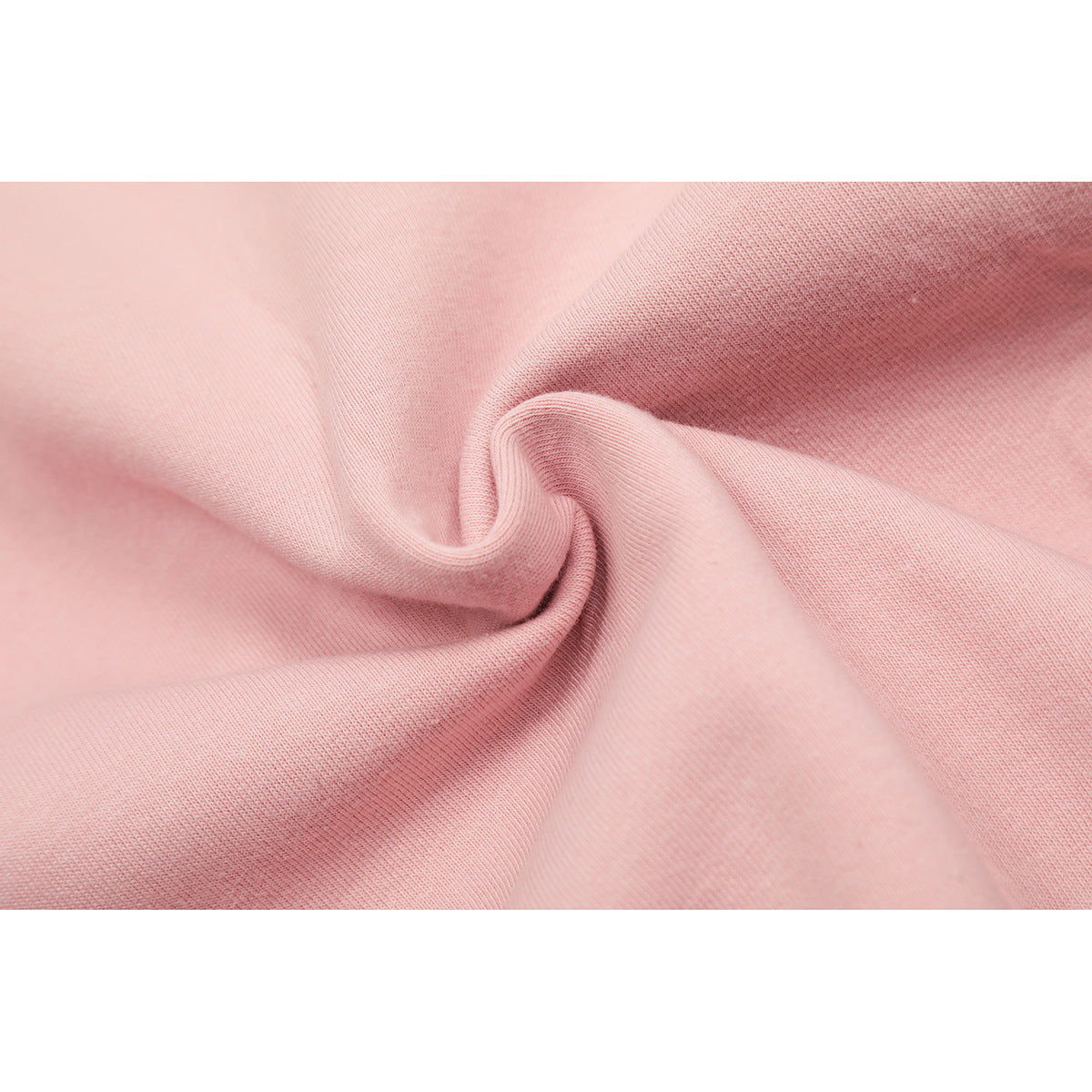 Close-up of pale pink knit fabric gathered into a soft twist, showing its surface texture.