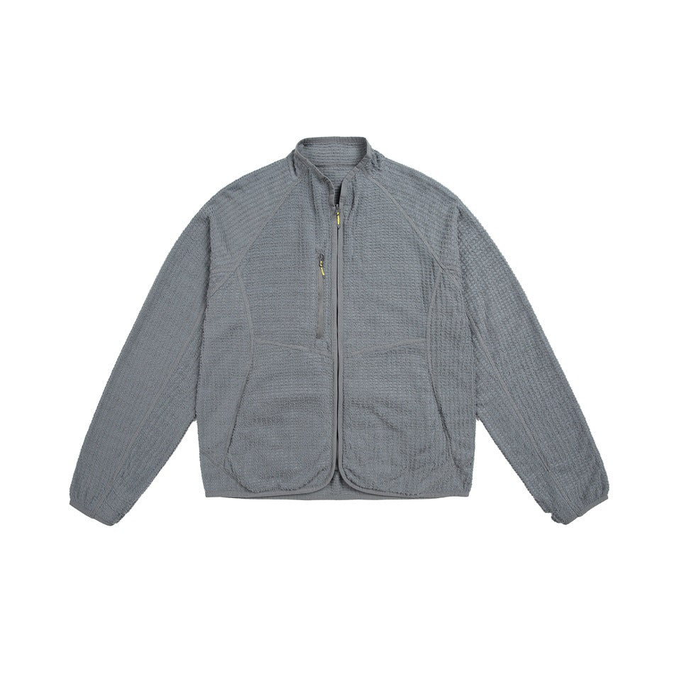 Gray textured fleece-style zip jacket with raglan sleeves, chest zip pocket and front pockets, flat front view