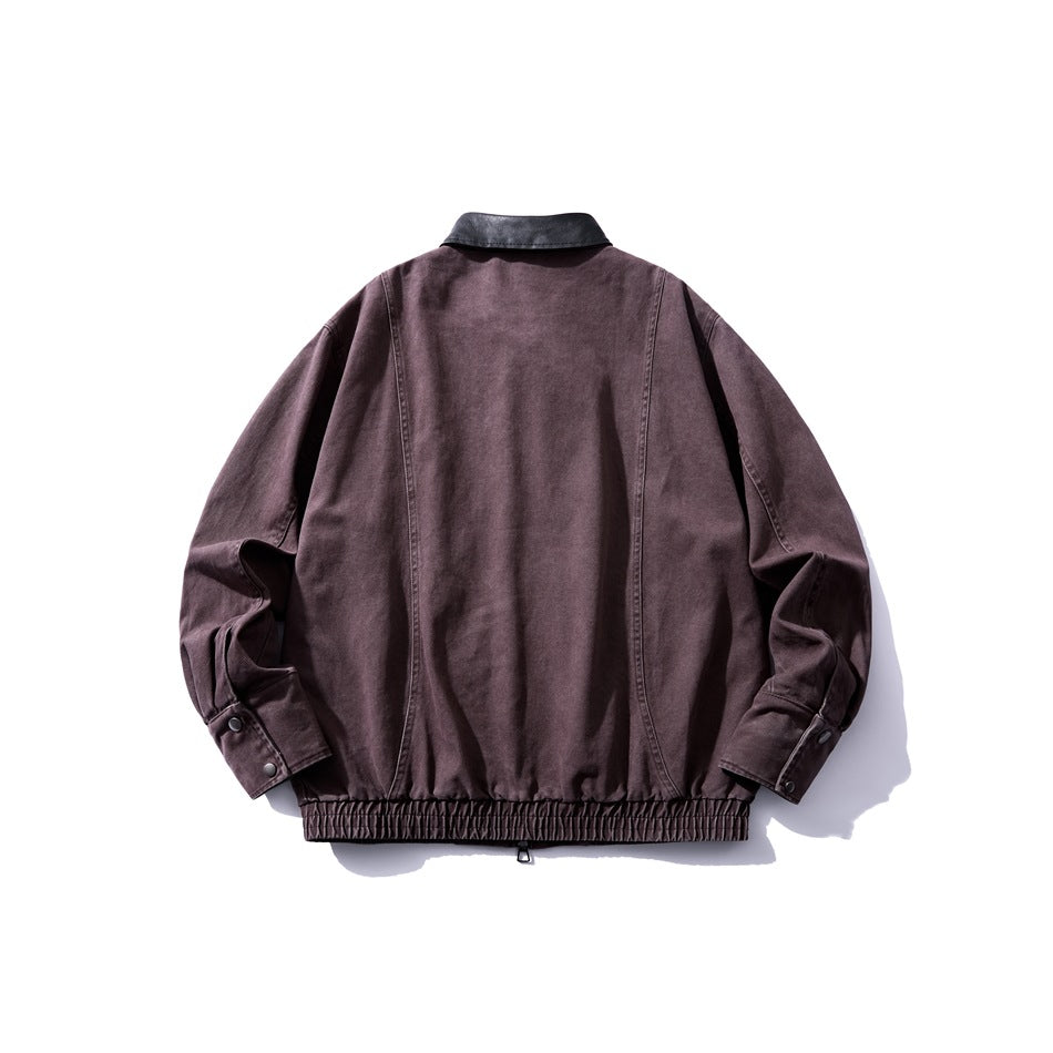 Back view of a dark plum jacket with a black collar, snap-button cuffs, and a gathered hem.
