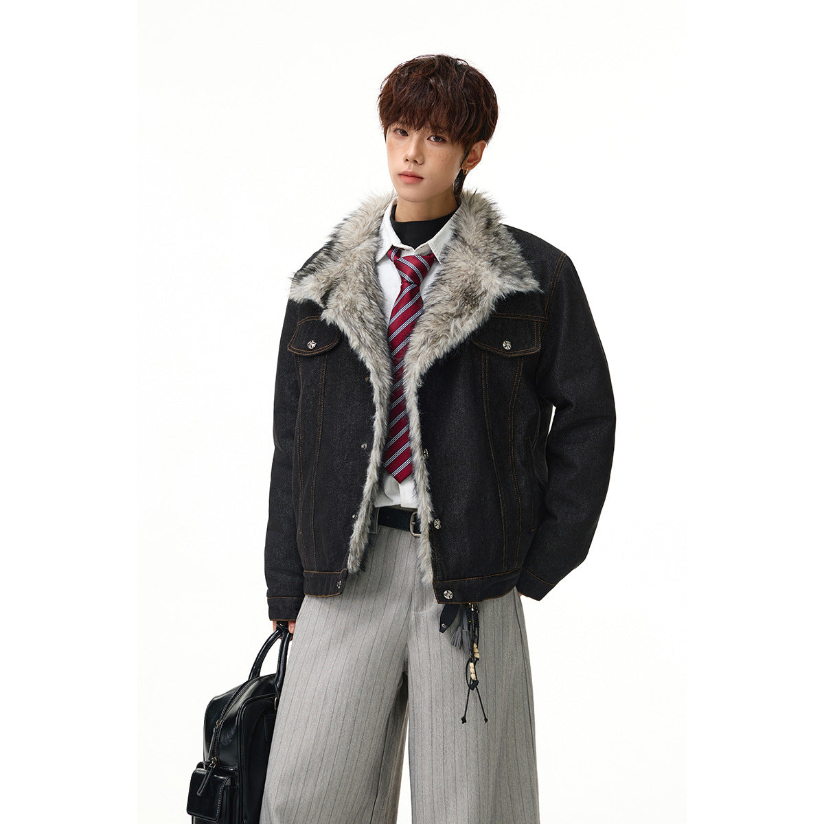 Model wearing an open charcoal denim jacket with a wide gray faux-fur collar and chest flap pockets.