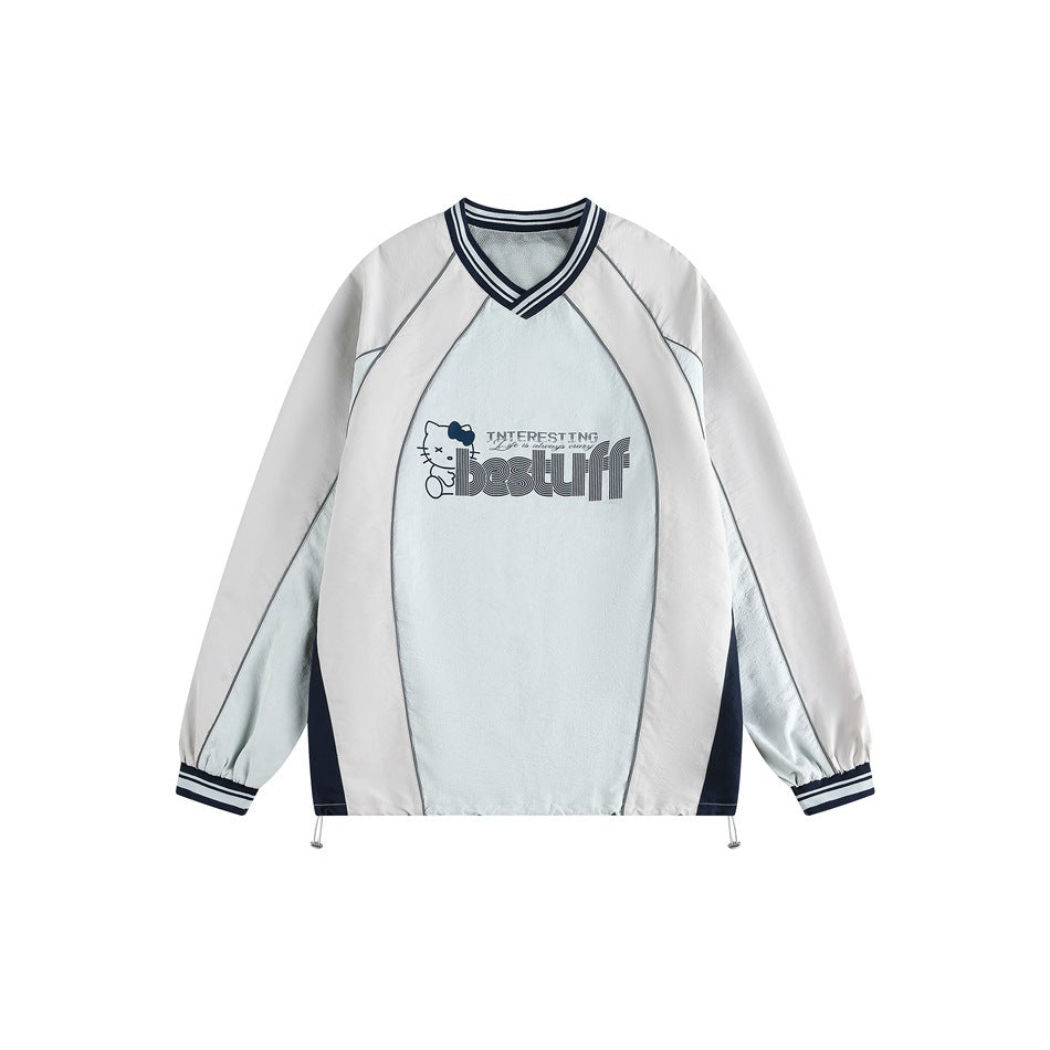 Front view of a white and pale blue pullover with navy striped V-neck and cuffs, contrast panels, and a chest graphic.