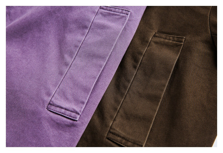 Close-up of rectangular welt pockets on purple and dark brown jackets.