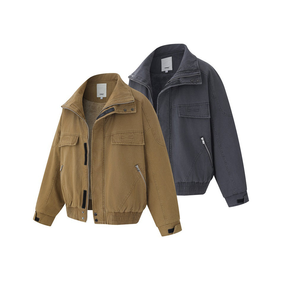 Two front-facing jackets in tan and charcoal, with stand collars, chest flap pockets, zip pockets and elastic hems.