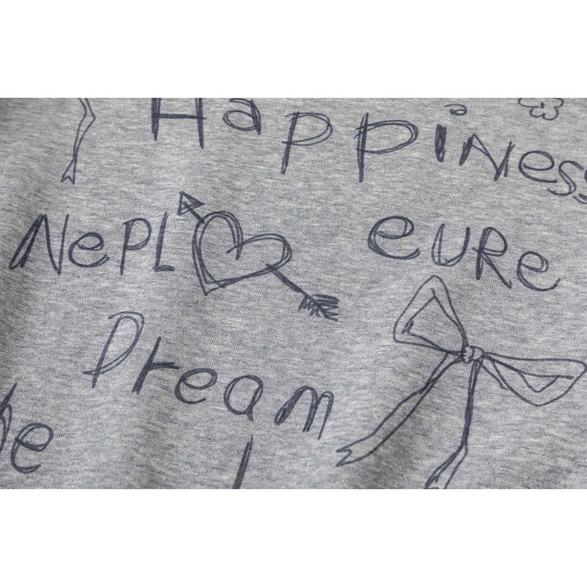 Close-up of a gray sweatshirt's hand-drawn text and doodle print, including bows and a heart with an arrow.