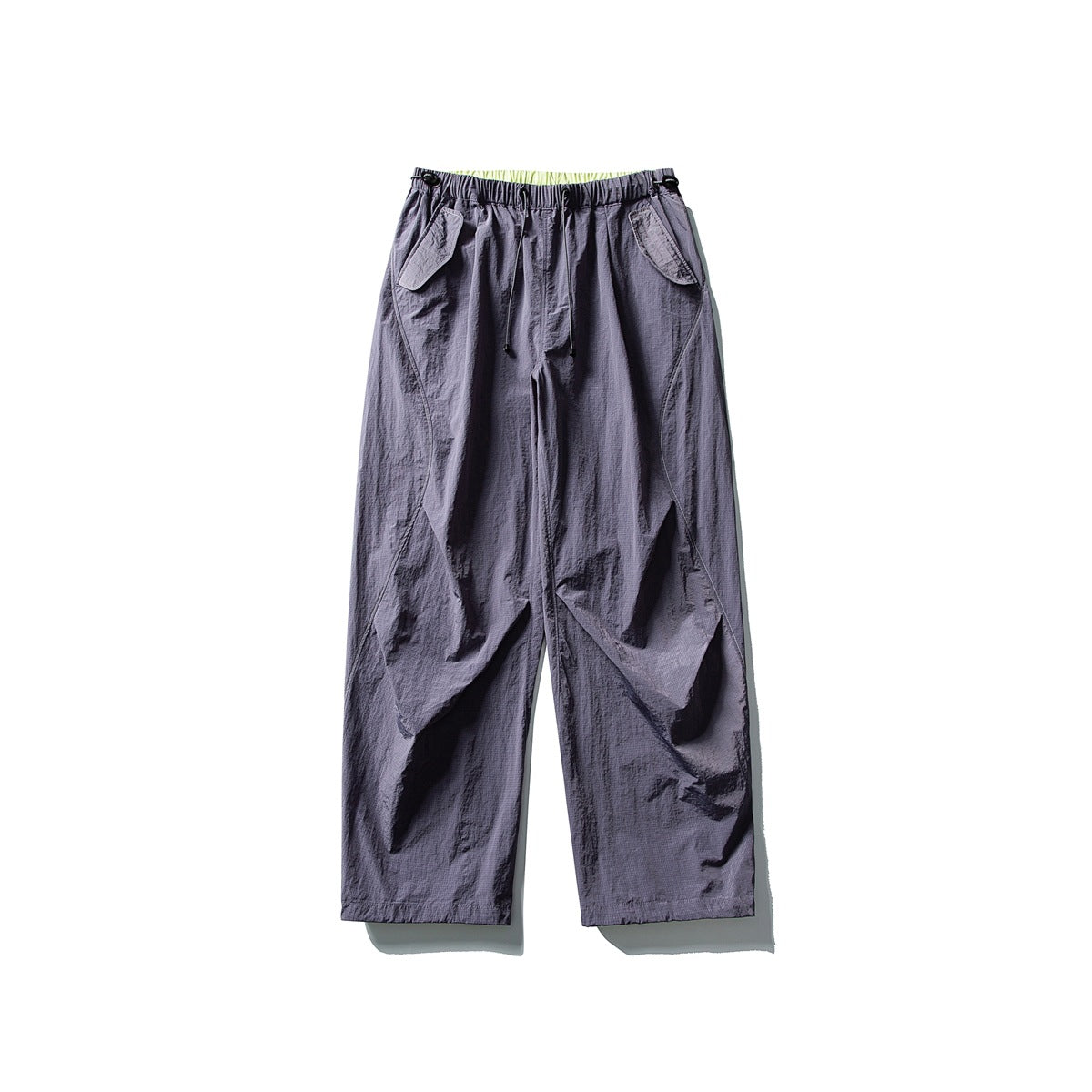 Dusty purple wide-leg pants with drawstring waist, flap pockets and lime inner waistband, flat lay