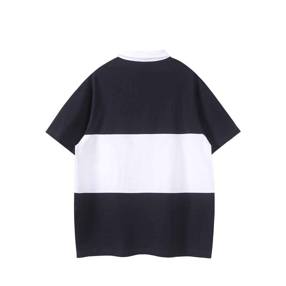 Back view of navy short-sleeve polo shirt with white collar and wide white horizontal band