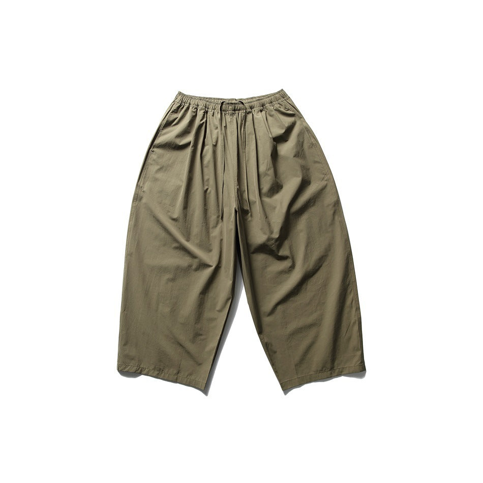 Army green wide-leg cropped pants with elastic drawstring waist, flat lay front view