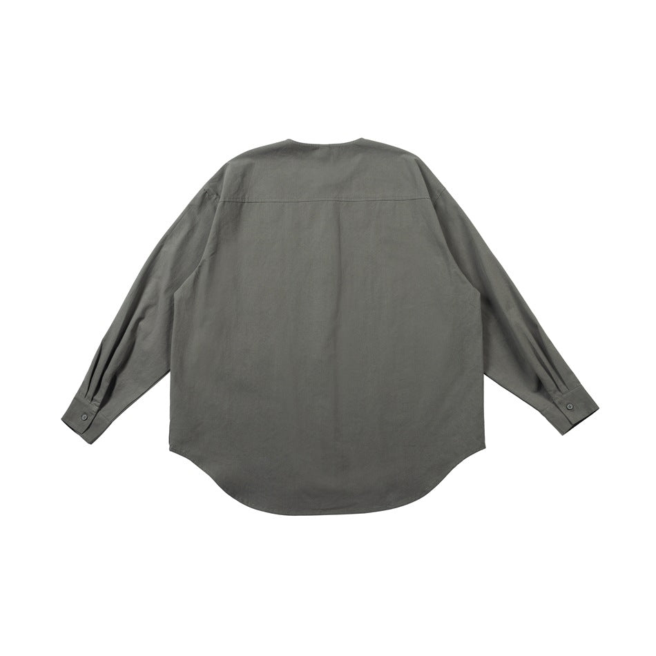 Back view of a loose, dark gray long-sleeve shirt with a curved hem and buttoned cuffs.