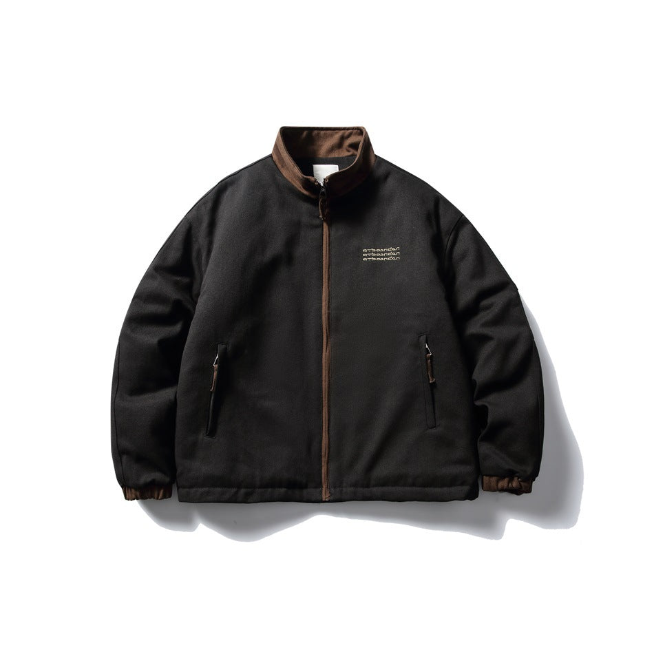Black stand-collar zip jacket with brown collar, brown zipper tape, zip hip pockets and brown ribbed cuffs, flat front view