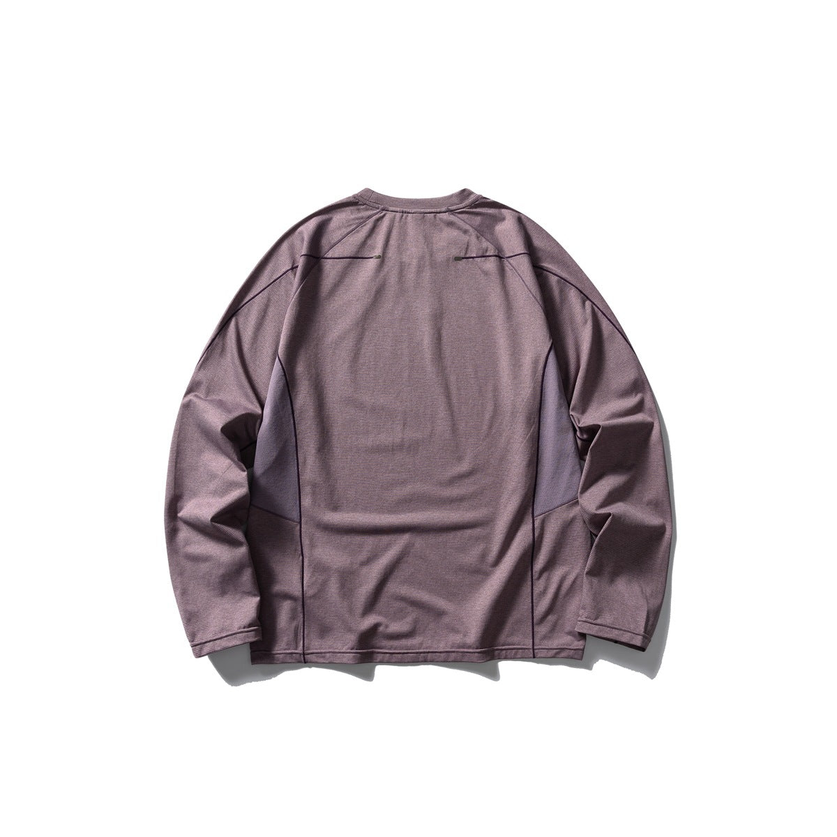 Back view of a muted mauve long-sleeve crewneck shirt with curved panel seams and dark piping.